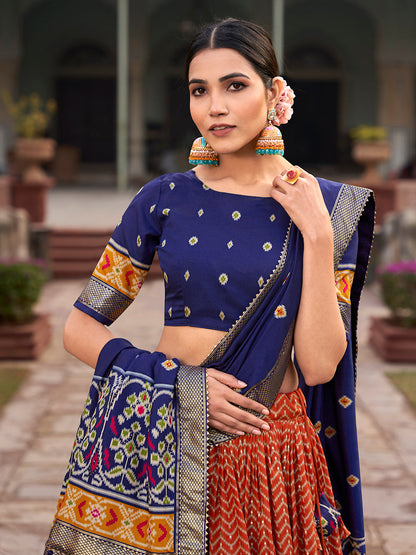 Orange Color Ikkat Patola With Foil Print Tussar Silk Lehenga Choli