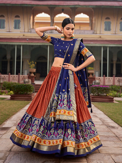 Orange Color Ikkat Patola With Foil Print Tussar Silk Lehenga Choli