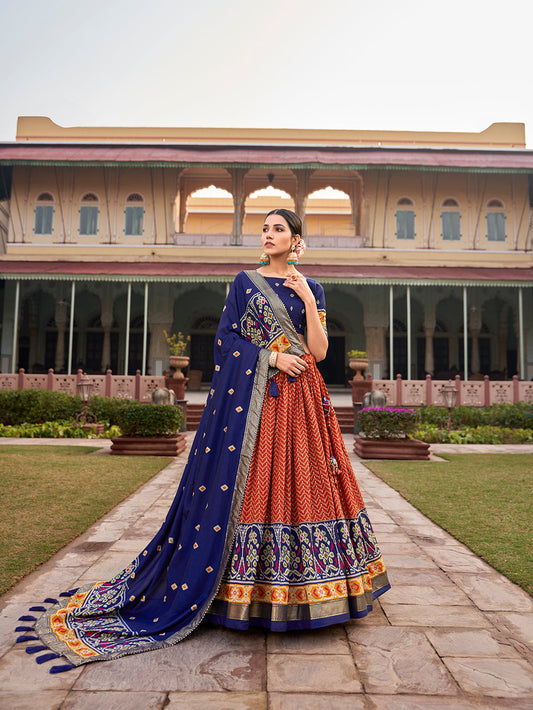 Orange Color Ikkat Patola With Foil Print Tussar Silk Lehenga Choli