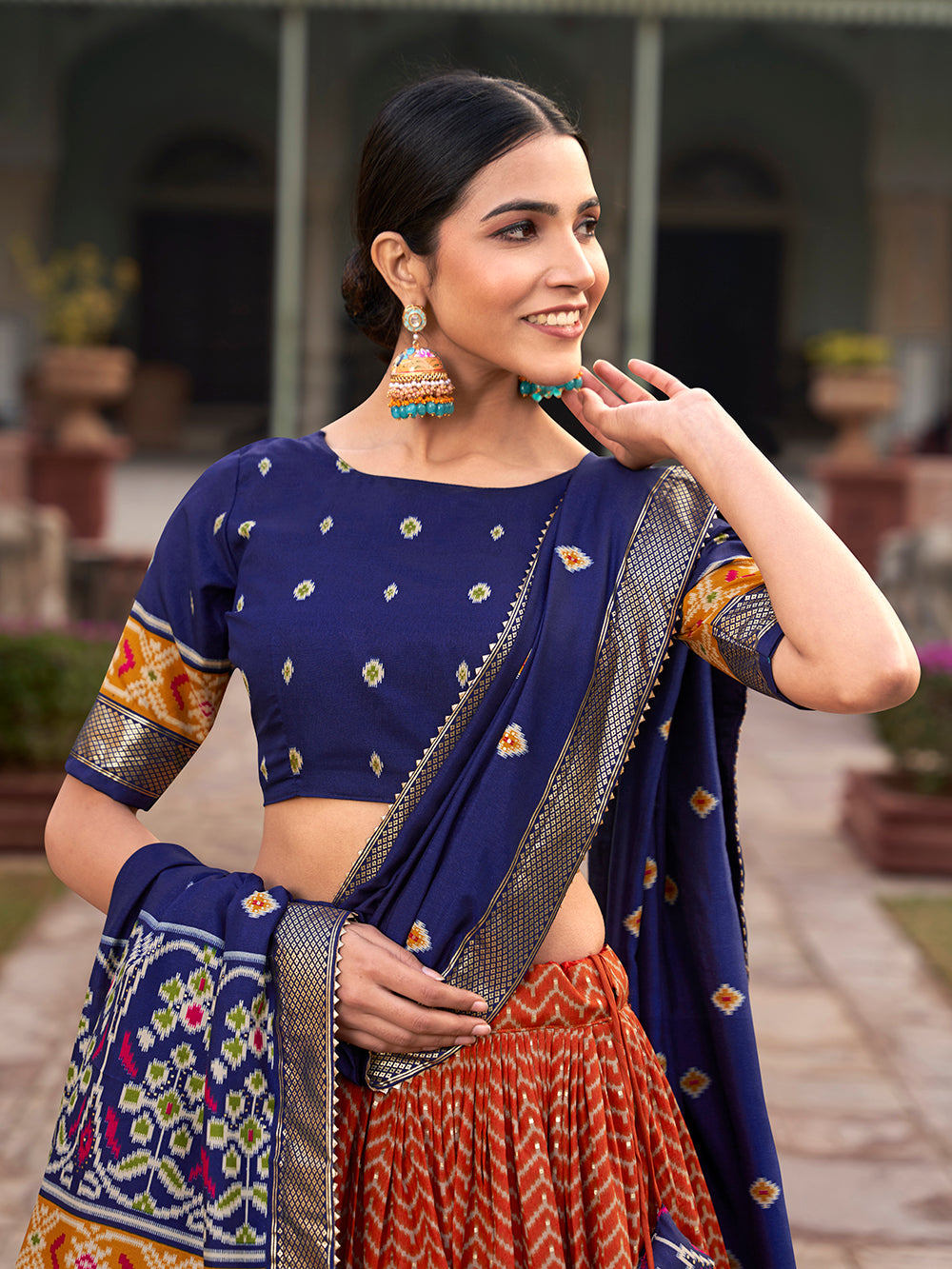 Orange Color Ikkat Patola With Foil Print Tussar Silk Lehenga Choli