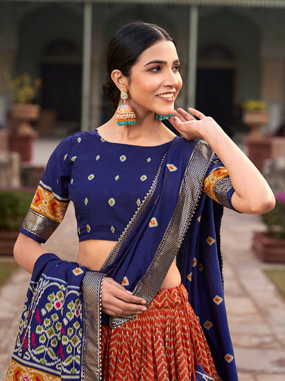 Orange Color Ikkat Patola With Foil Print Tussar Silk Lehenga Choli